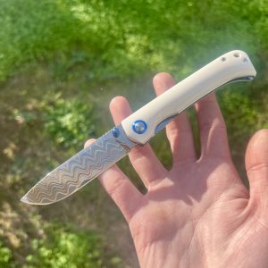 Petit couteau pliant acier damas cuivre #324